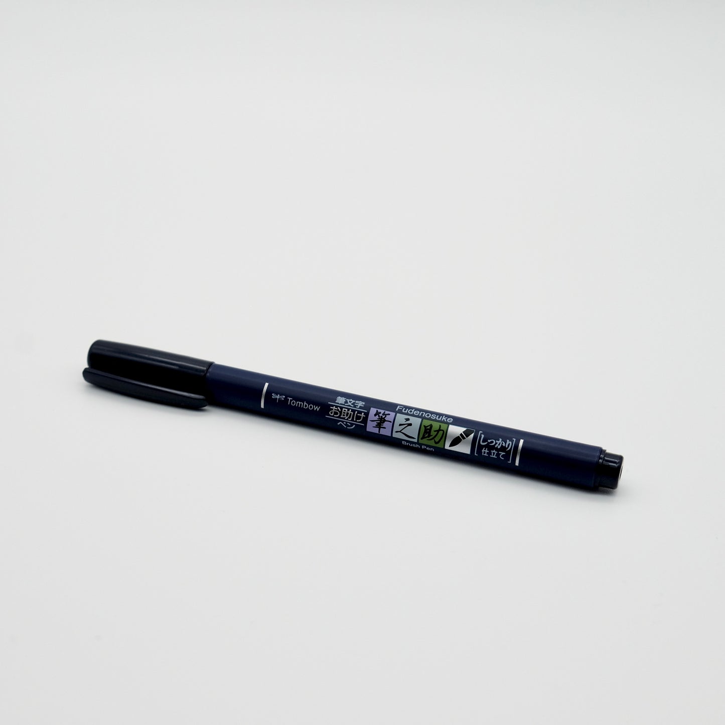 Black marker pen on a white background