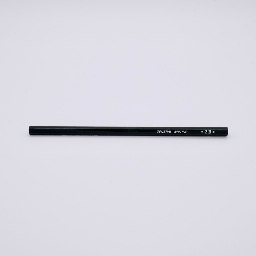 Black pencil labeled '2B' on a light gray background