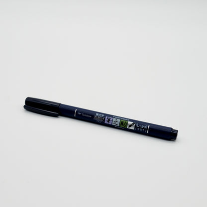 Black marker pen on a white background