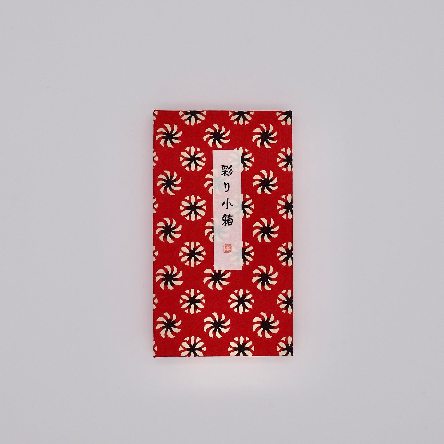 Red envelope with black and white pattern on a gray background