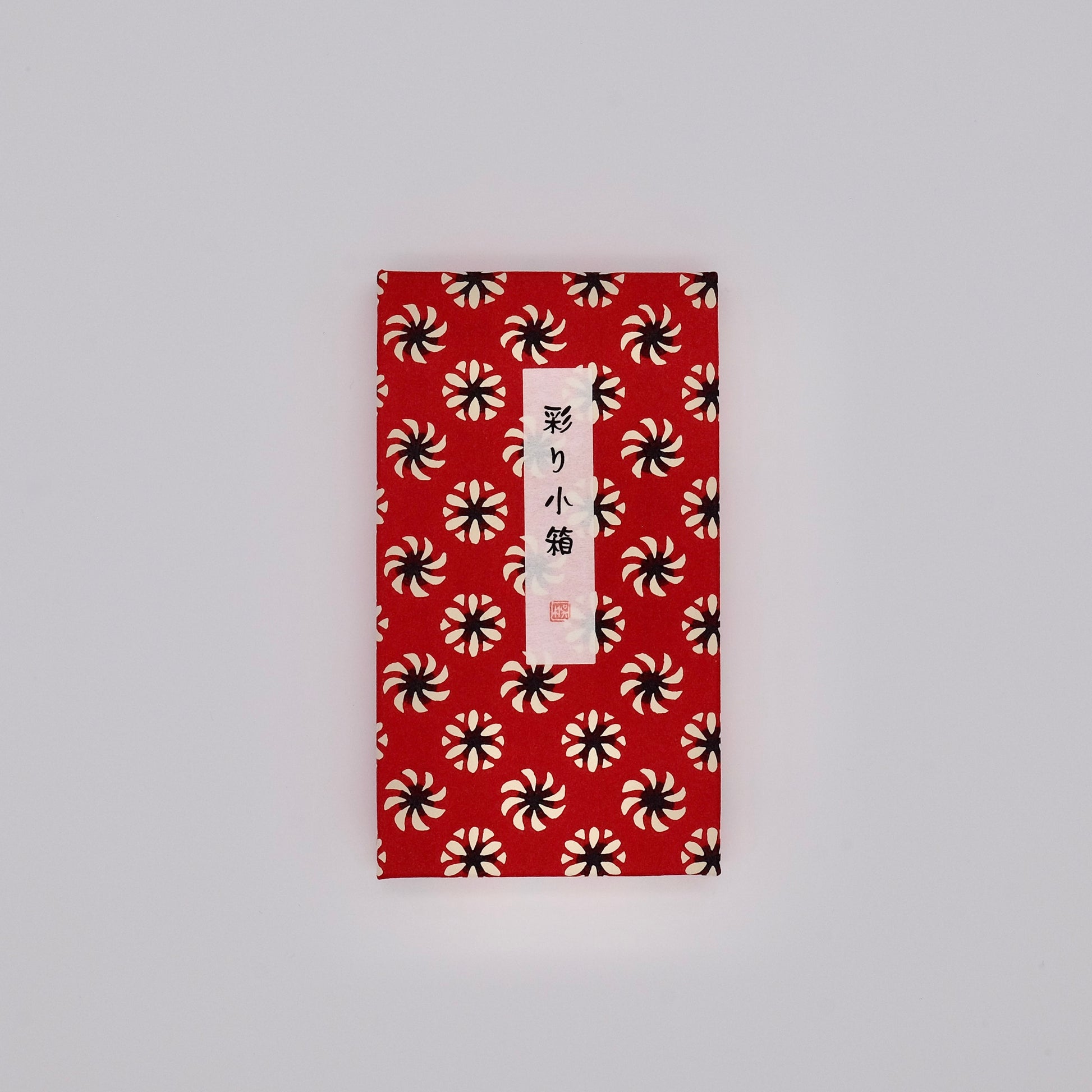 Red envelope with black and white pattern on a gray background