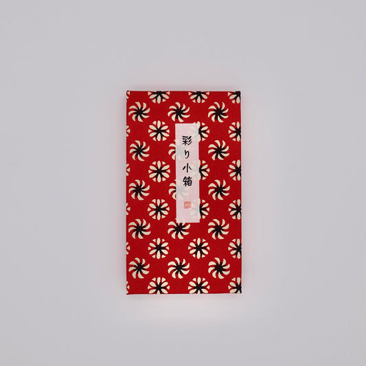 Red envelope with black and white pattern on a gray background
