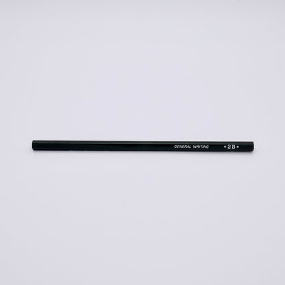 Black pencil labeled '2B' on a light gray background