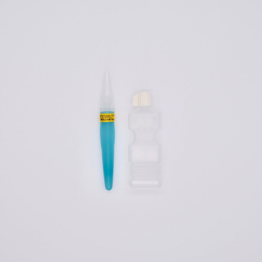Teal watercolor brush with a white handle on a light gray background