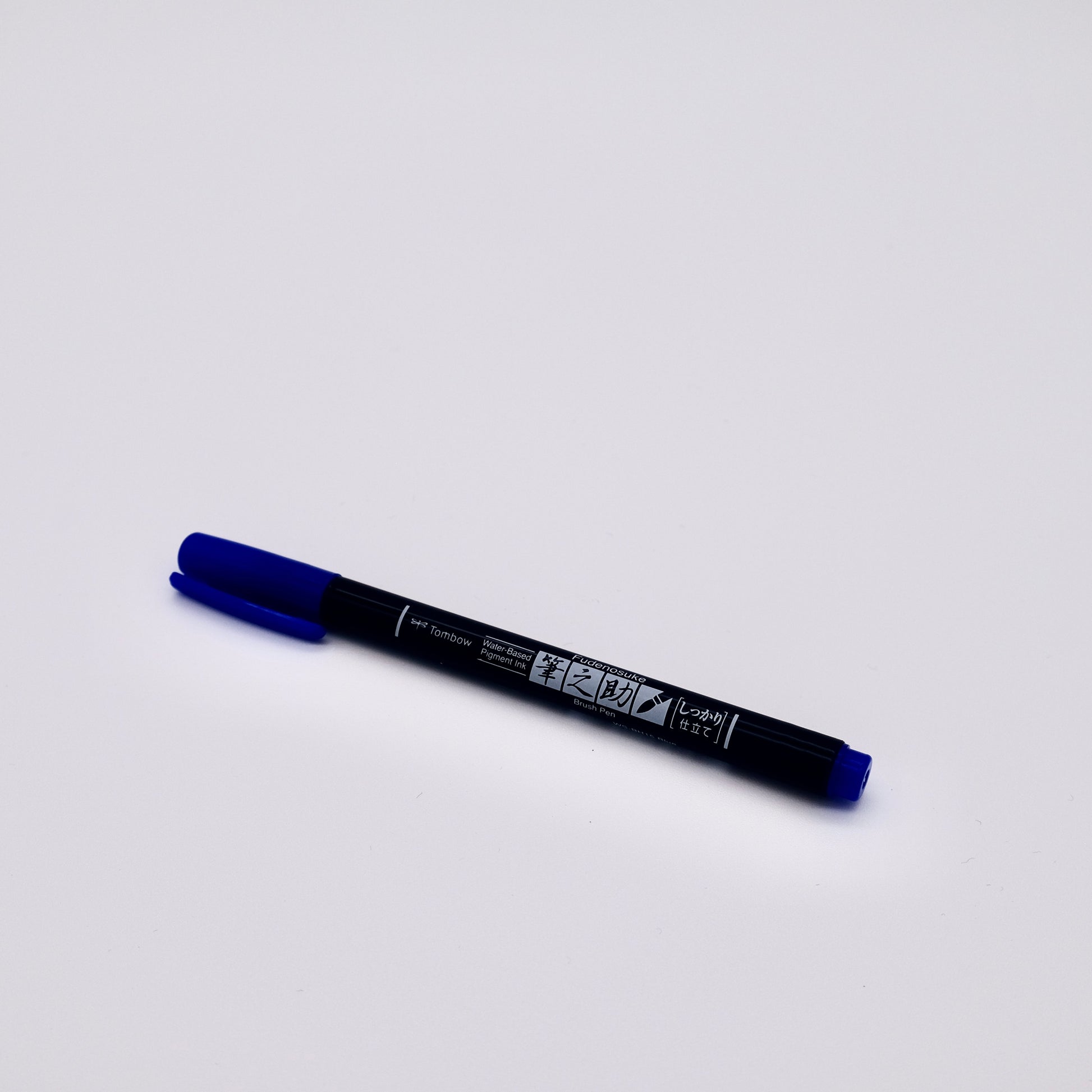 Blue marker pen on a white background