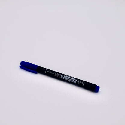 Blue marker pen on a white background