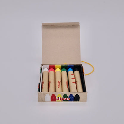 Box of colorful crayons with 'kitpas' branding on a white background