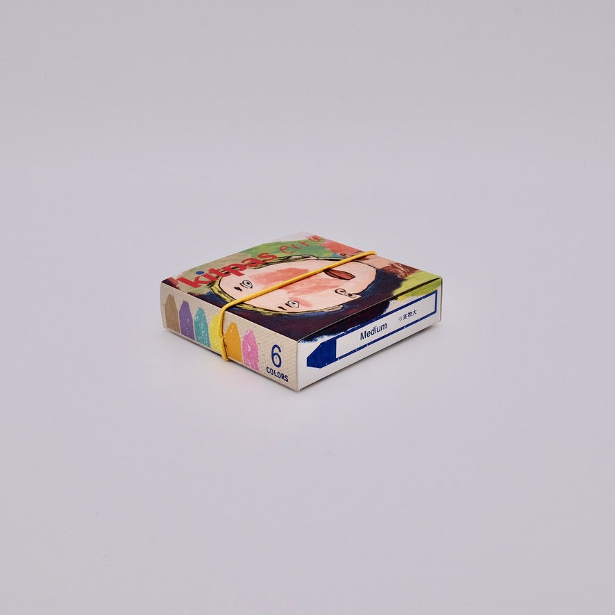 Box of 6 medium crayons with colorful designs on a gray background