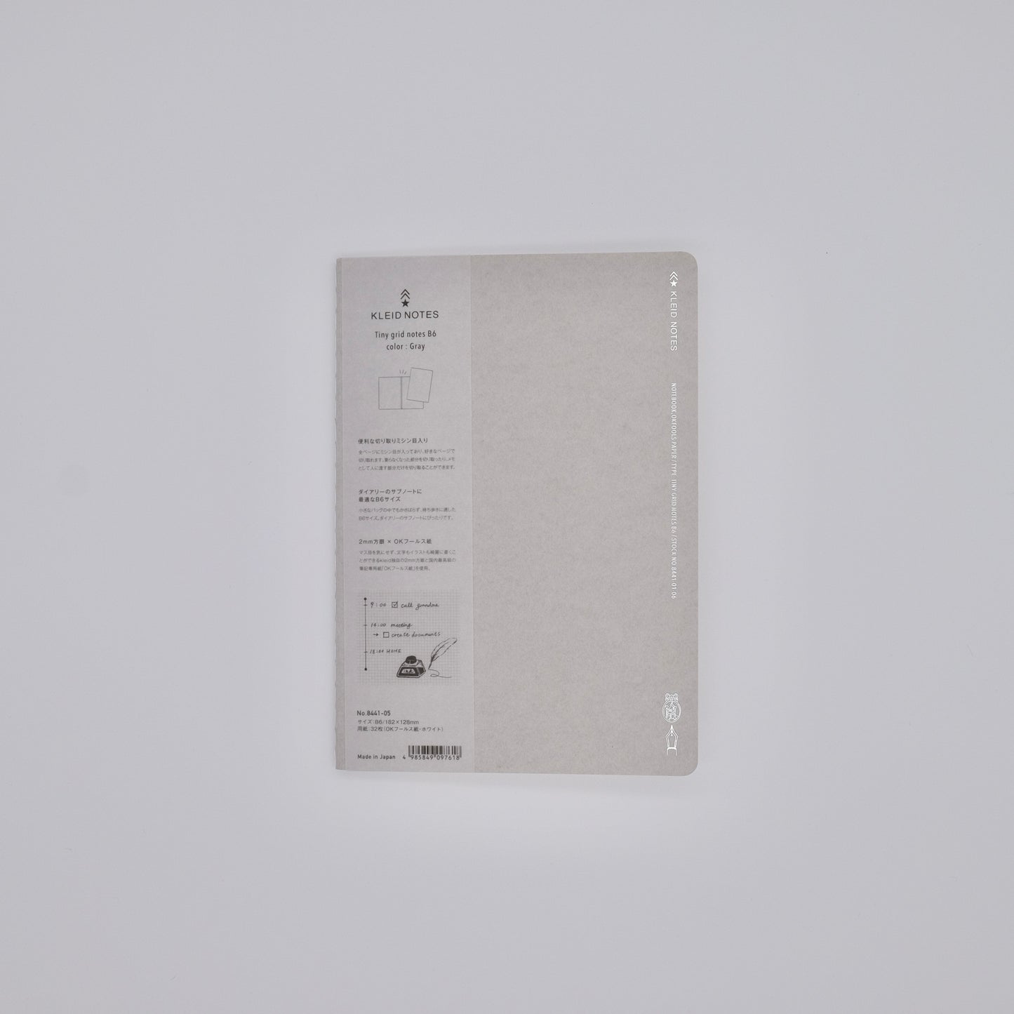 Gray notebook with text on a light gray background