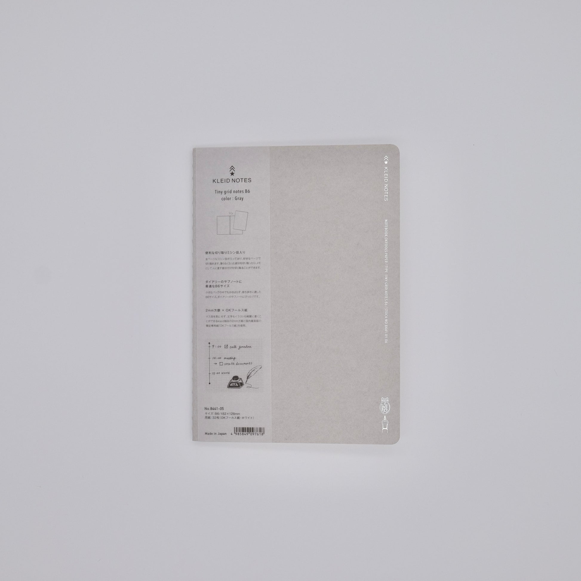 Gray notebook with text on a light gray background