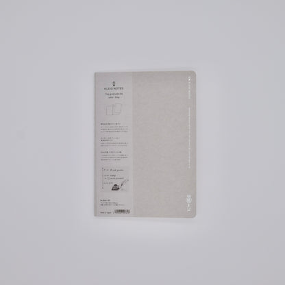 Gray notebook with text on a light gray background