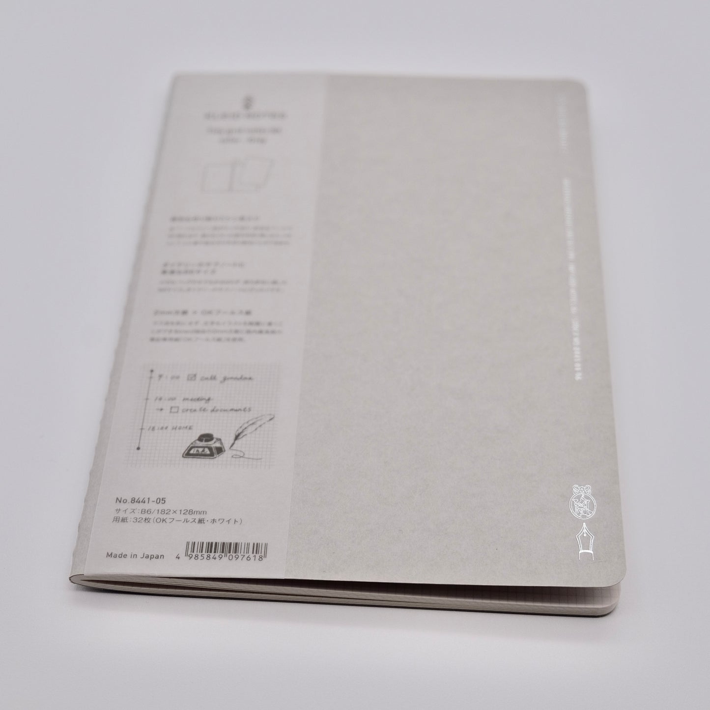 Gray notebook with text and design on a white background