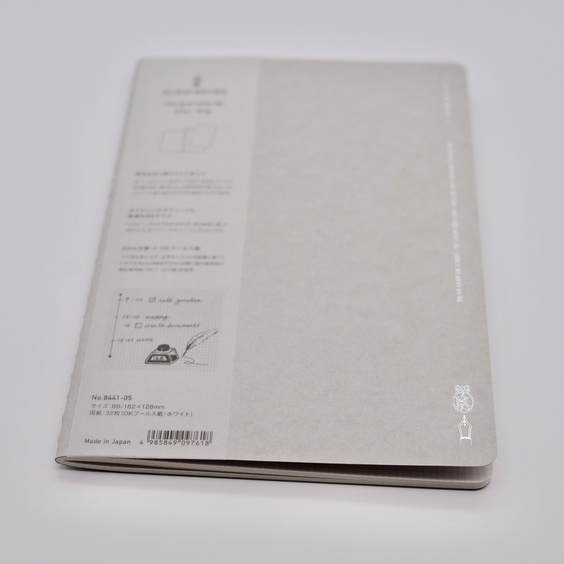 Gray notebook with text and design on a white background