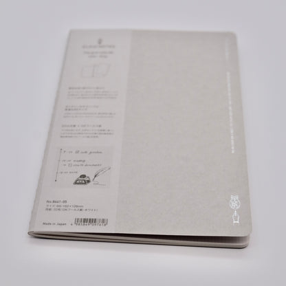 Gray notebook with text and design on a white background