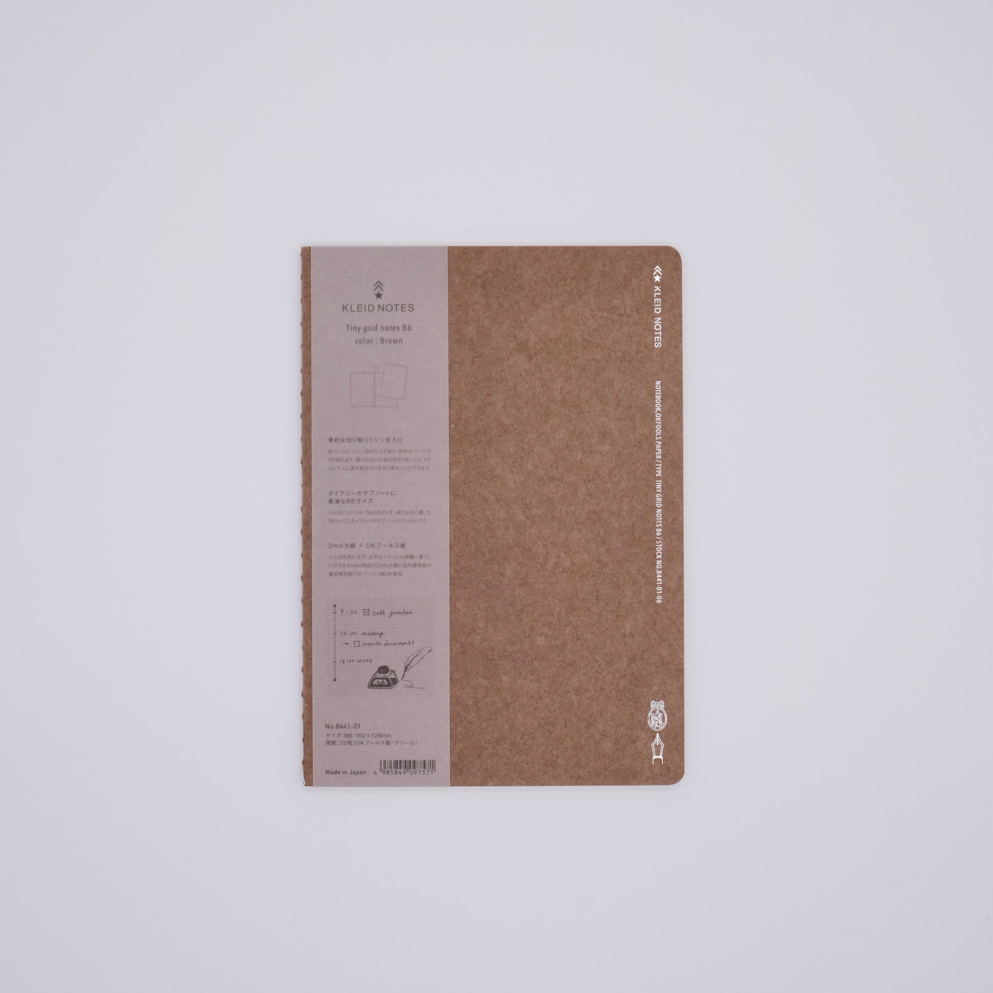 Brown notebook with text on a white background