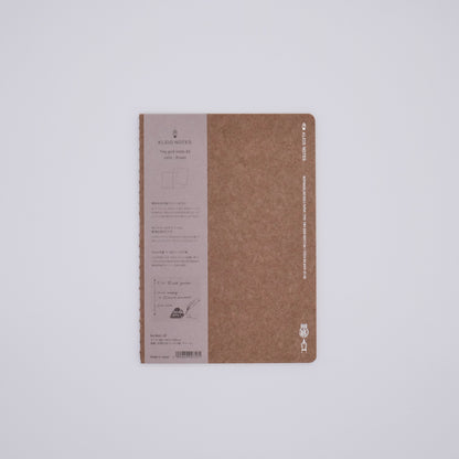 Brown notebook with text on a white background