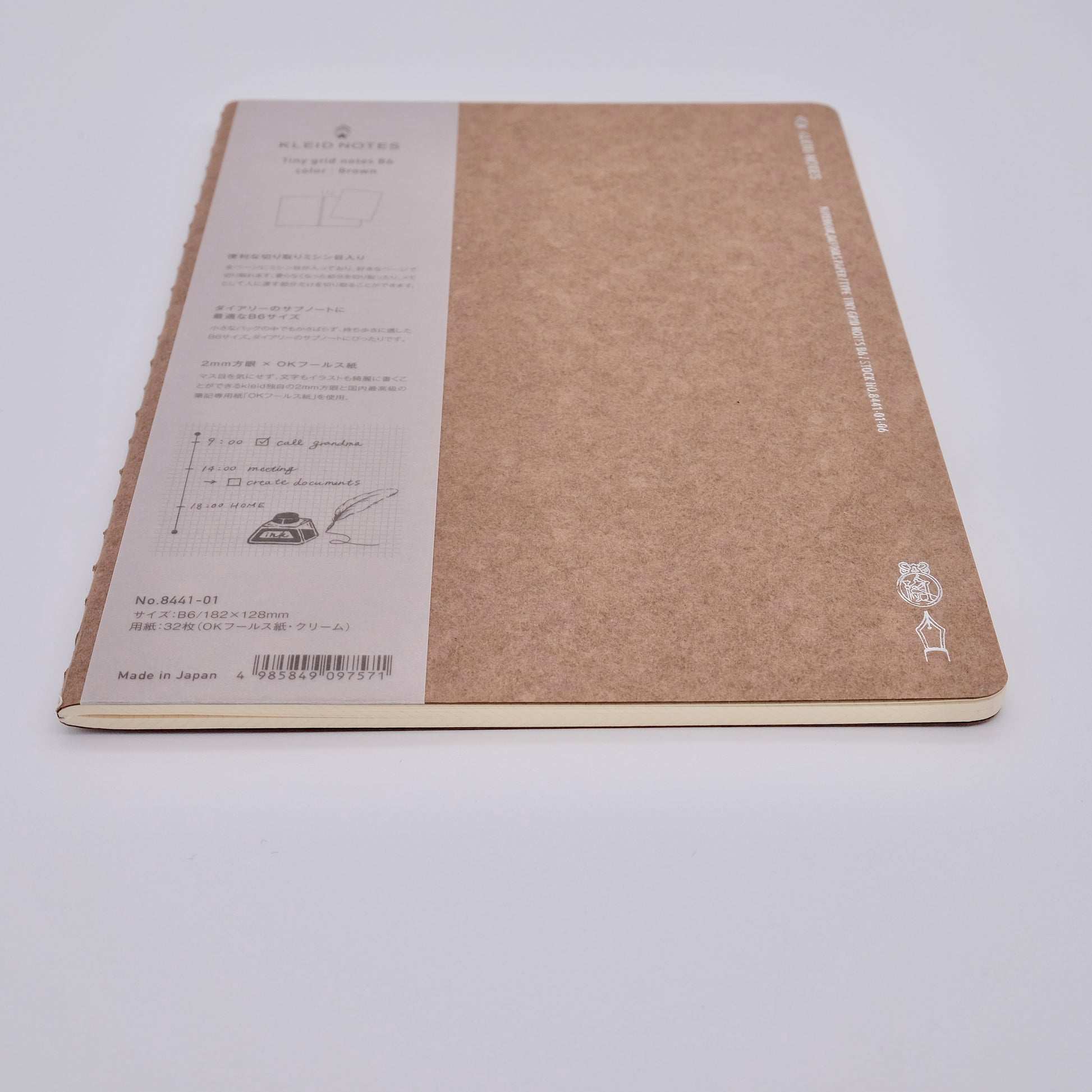 Brown notebook with label on a white background