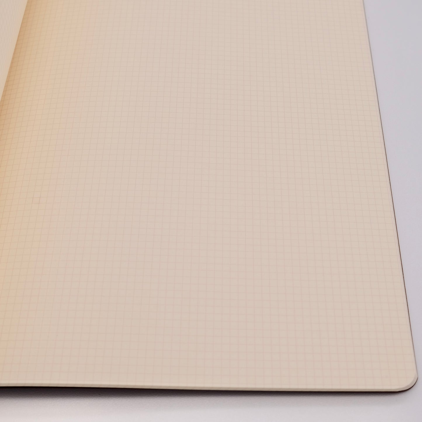Beige textured mouse pad on a white background