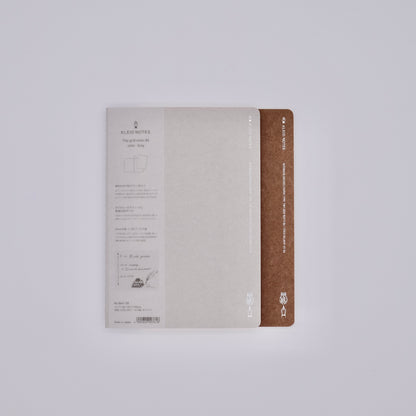 Notebook with beige cover and brown spine on a white background