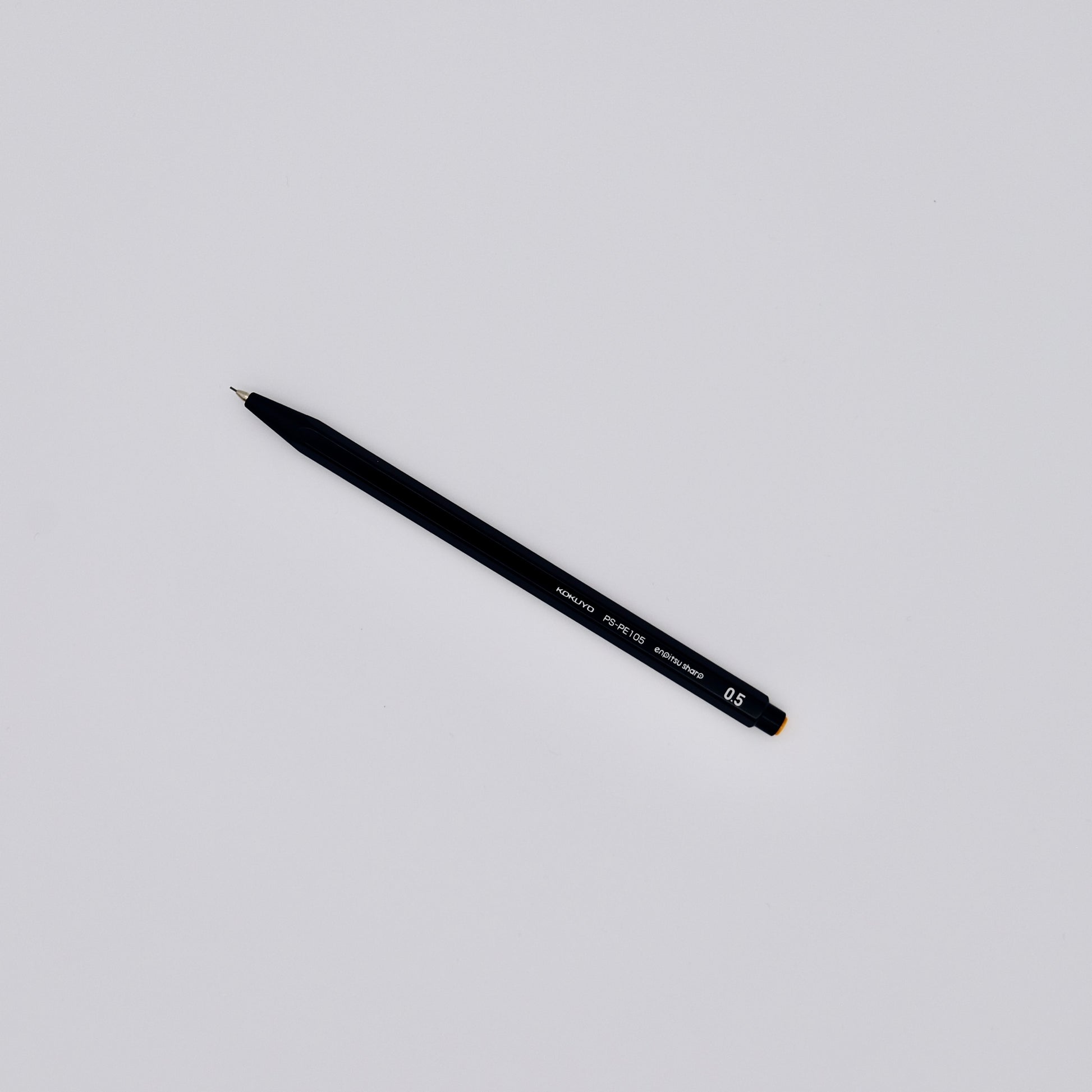 Black mechanical pencil on a white background