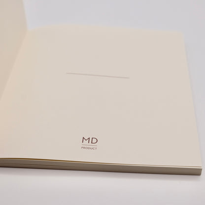 Notebook with 'MD PRODUCT' branding on a white background