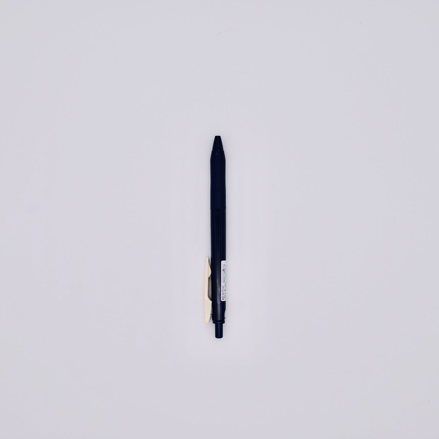 dark navy blue pen on white background