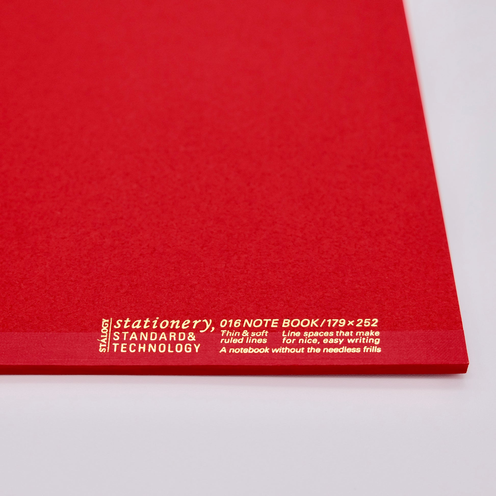 Red notebook with white text on a white background