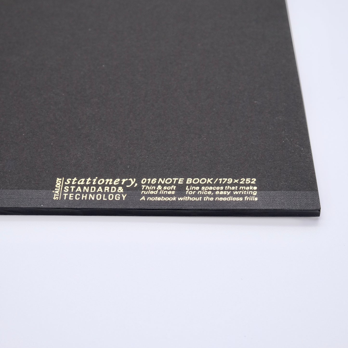 Black notebook with white text on a white background
