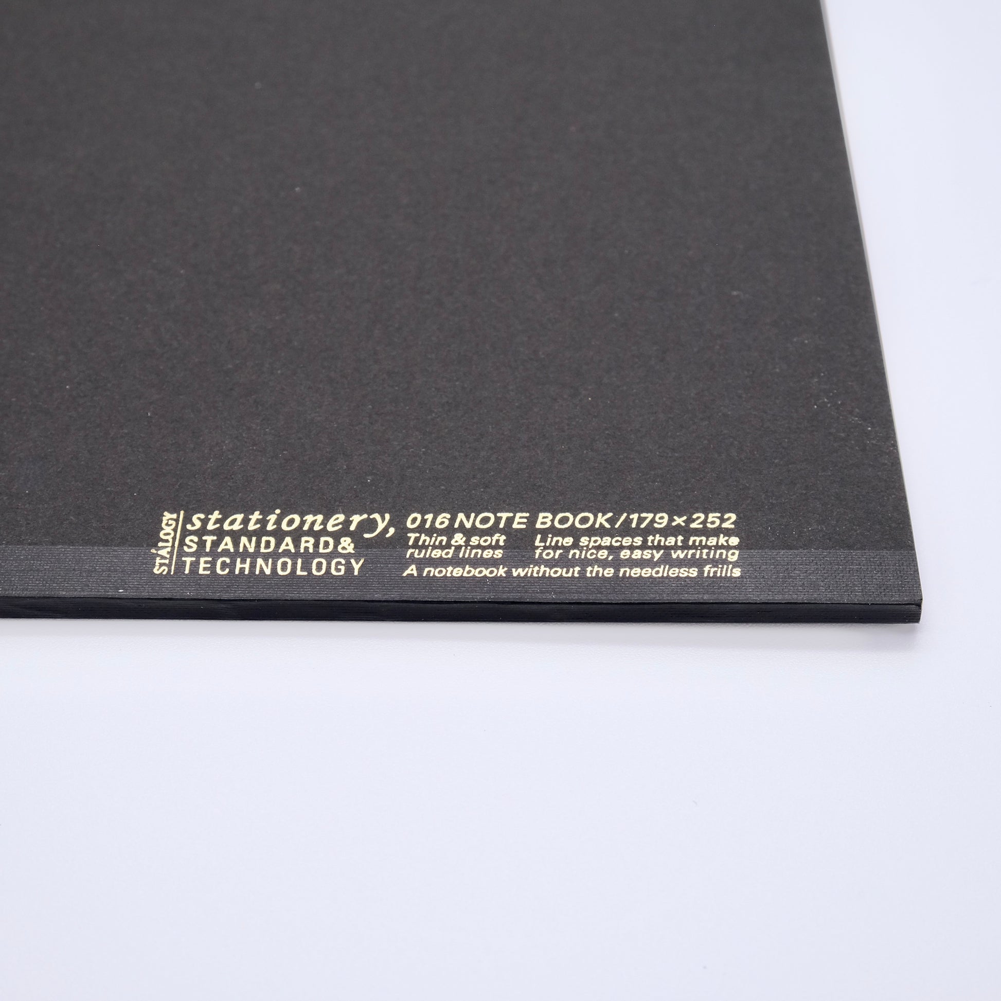 Black notebook with white text on a white background