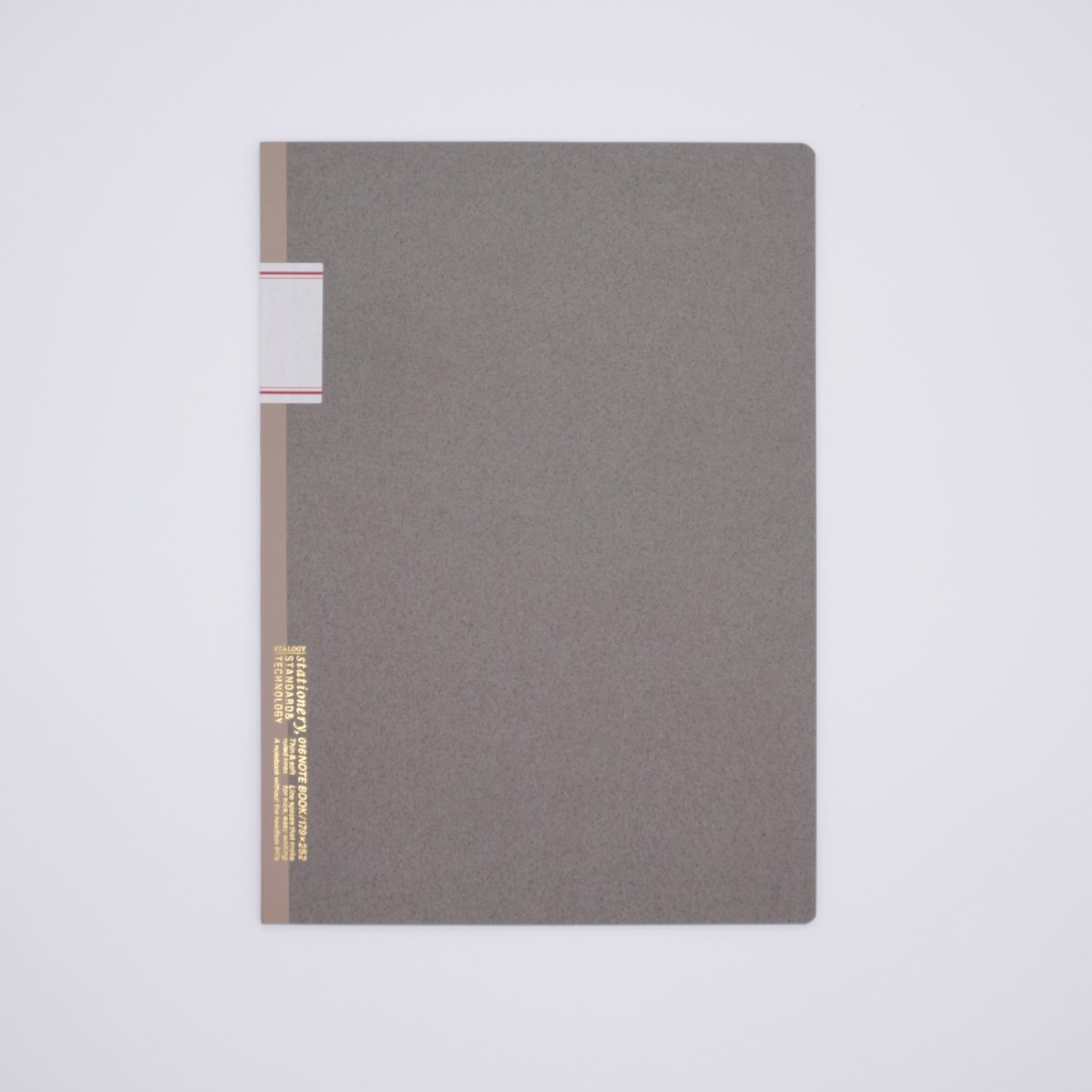 Gray notebook with gold and red accents on a light gray background