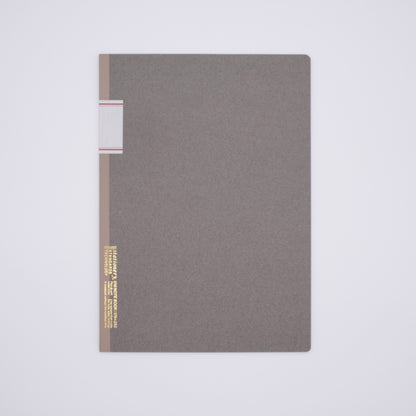 Gray notebook with gold and red accents on a light gray background