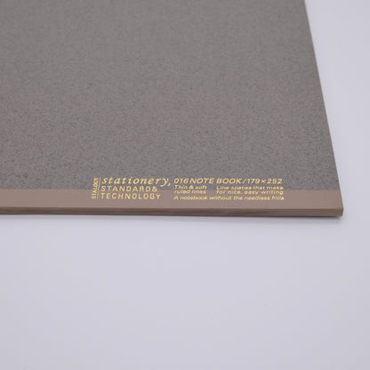Gray notebook with gold text on a white background
