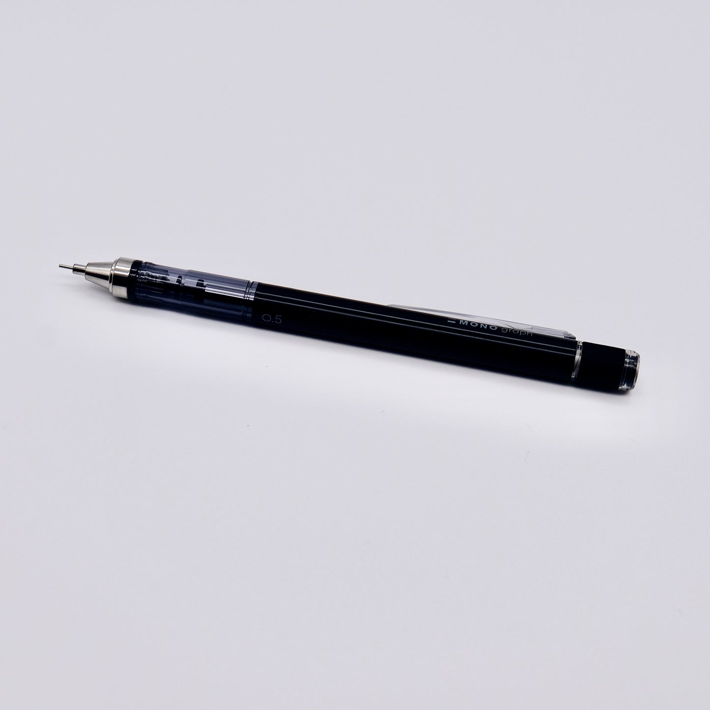 Black mechanical pencil on a white background