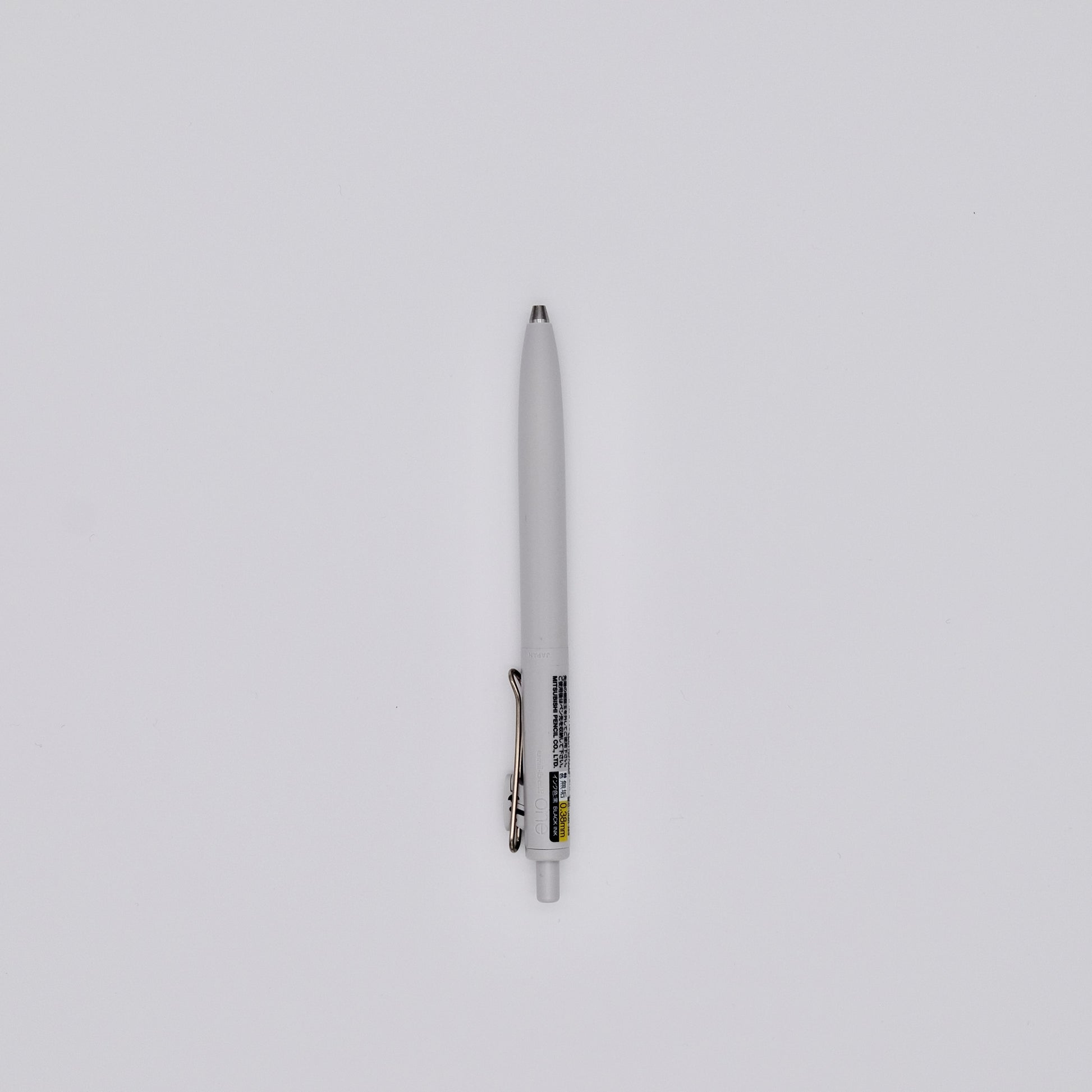 White pen on a light gray background